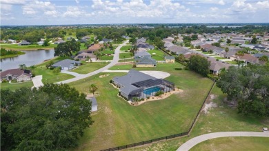 STUNNING GOLF FRONT OASIS WITH RESORT-STYLE OUTDOOR LIVING on Miona Lake Golf Club in Florida - for sale on GolfHomes.com, golf home, golf lot