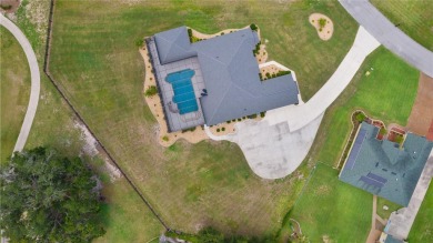 STUNNING GOLF FRONT OASIS WITH RESORT-STYLE OUTDOOR LIVING on Miona Lake Golf Club in Florida - for sale on GolfHomes.com, golf home, golf lot