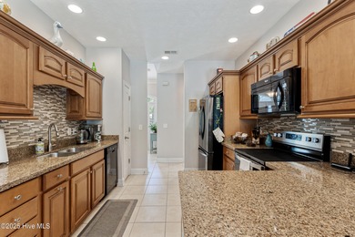 EXCEPTIONAL IS THE WORD! This pristine home is tucked away on a on Carolina Shores Golf Course in North Carolina - for sale on GolfHomes.com, golf home, golf lot