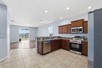 One or more photo(s) has been virtually staged. Located within on Sherman Hills Golf Club in Florida - for sale on GolfHomes.com, golf home, golf lot