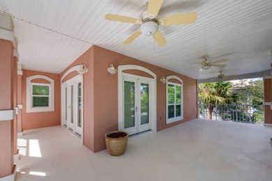 Discover coastal living at its finest in this elegant on Regatta Bay Golf and Country Club in Florida - for sale on GolfHomes.com, golf home, golf lot