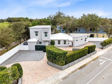 Welcome to this beautifully designed 3-bedroom, 2-bathroom home on Winter Park Country Club in Florida - for sale on GolfHomes.com, golf home, golf lot