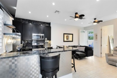 Welcome to this beautifully designed 3-bedroom, 2-bathroom home on Winter Park Country Club in Florida - for sale on GolfHomes.com, golf home, golf lot