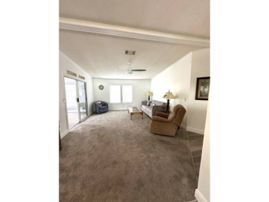 Your Tranquil Tree-Lined Retreat Awaits: Stunning Turn-Key on Grasslands Golf and Country Club in Florida - for sale on GolfHomes.com, golf home, golf lot