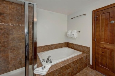This exquisite top-floor residence in Highland Greens Lodge on Breckenridge Golf Club in Colorado - for sale on GolfHomes.com, golf home, golf lot