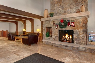 This exquisite top-floor residence in Highland Greens Lodge on Breckenridge Golf Club in Colorado - for sale on GolfHomes.com, golf home, golf lot