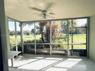 This first-floor corner unit is right on the golf course in Palm on Palm-Aire Country Club and Resort - The Oaks in Florida - for sale on GolfHomes.com, golf home, golf lot