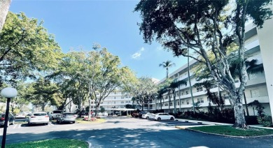 This first-floor corner unit is right on the golf course in Palm on Palm-Aire Country Club and Resort - The Oaks in Florida - for sale on GolfHomes.com, golf home, golf lot