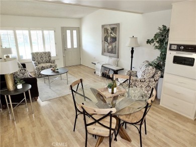 Charming and expanded one-bedroom, one-bathroom cottage nestled on Leisure World Seal Beach Golf Course in California - for sale on GolfHomes.com, golf home, golf lot