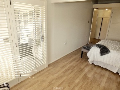 Charming and expanded one-bedroom, one-bathroom cottage nestled on Leisure World Seal Beach Golf Course in California - for sale on GolfHomes.com, golf home, golf lot