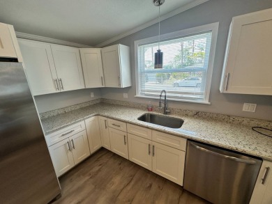 Lot rent is $1037.00    This beautiful 2 bedroom, 2 bathroom on Del Tura Golf and Country Club in Florida - for sale on GolfHomes.com, golf home, golf lot