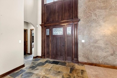 Welcome to this stunning reverse 1.5-story beauty overlooking on Shadow Glen Golf Club in Kansas - for sale on GolfHomes.com, golf home, golf lot