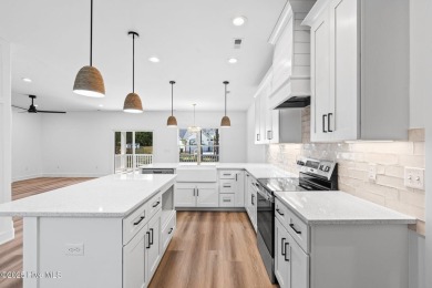 Nestled in the heart of the Shallotte Point area, this home on Rivers Edge Golf Club in North Carolina - for sale on GolfHomes.com, golf home, golf lot
