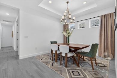 Experience modern luxury and effortless sophistication in this on Esplanade Golf and Country at Lakewood Ranch in Florida - for sale on GolfHomes.com, golf home, golf lot