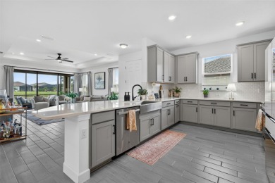 Experience modern luxury and effortless sophistication in this on Esplanade Golf and Country at Lakewood Ranch in Florida - for sale on GolfHomes.com, golf home, golf lot