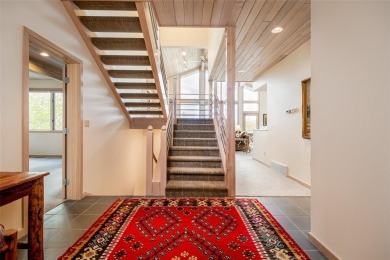 This exceptional 4-bedroom mountain home is perfectly perched on on Rollingstone Ranch Golf Club in Colorado - for sale on GolfHomes.com, golf home, golf lot