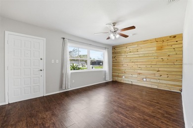 This beautifully maintained three-bedroom, two-bath home with a on The Dunedin Country Club in Florida - for sale on GolfHomes.com, golf home, golf lot