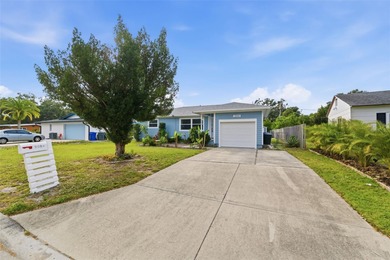This beautifully maintained three-bedroom, two-bath home with a on The Dunedin Country Club in Florida - for sale on GolfHomes.com, golf home, golf lot