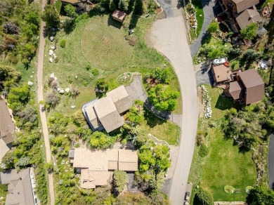 This exceptional 4-bedroom mountain home is perfectly perched on on Rollingstone Ranch Golf Club in Colorado - for sale on GolfHomes.com, golf home, golf lot