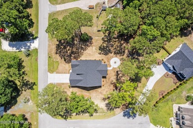 Nestled in the heart of the Shallotte Point area, this home on Rivers Edge Golf Club in North Carolina - for sale on GolfHomes.com, golf home, golf lot