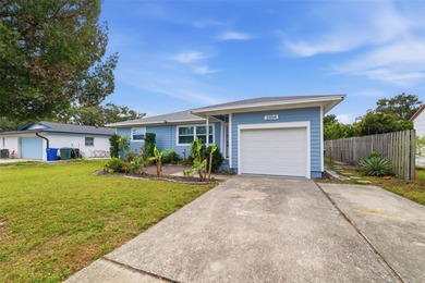 This beautifully maintained three-bedroom, two-bath home with a on The Dunedin Country Club in Florida - for sale on GolfHomes.com, golf home, golf lot