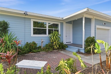 This beautifully maintained three-bedroom, two-bath home with a on The Dunedin Country Club in Florida - for sale on GolfHomes.com, golf home, golf lot