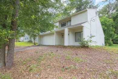 Nestled on a quiet corner lot near the Lawson Road entrance, and on Lake Forest Yacht and Country Club in Alabama - for sale on GolfHomes.com, golf home, golf lot