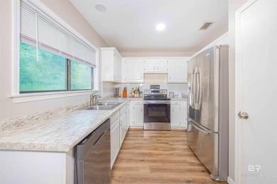 Nestled on a quiet corner lot near the Lawson Road entrance, and on Lake Forest Yacht and Country Club in Alabama - for sale on GolfHomes.com, golf home, golf lot