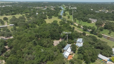 Tucked within a serene, tree-lined cul-de-sac, this timeless New on Mill Creek Golf Club in Texas - for sale on GolfHomes.com, golf home, golf lot