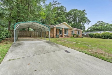 Welcome to this charming 1,530 square foot brick and slab, low on Magnolia Grove Golf Club in Alabama - for sale on GolfHomes.com, golf home, golf lot