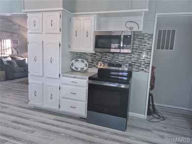 Don't miss this wonderful updated ranch home on in the Private on Terre Du Lac Golf and Country Club in Missouri - for sale on GolfHomes.com, golf home, golf lot