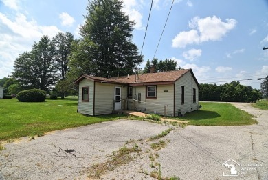 Discover the potential of this 2/3-bedroom ranch home situated on Dundee Golf Club in Michigan - for sale on GolfHomes.com, golf home, golf lot