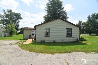 Discover the potential of this 2/3-bedroom ranch home situated on Dundee Golf Club in Michigan - for sale on GolfHomes.com, golf home, golf lot