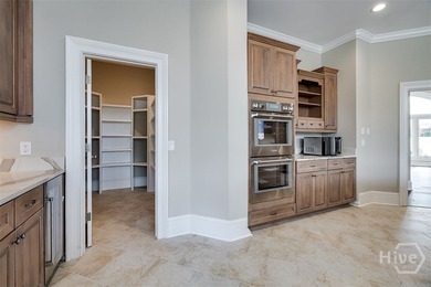 Executive-style living on the 9th hole of Black Creek Golf on Black Creek Golf Club in Georgia - for sale on GolfHomes.com, golf home, golf lot