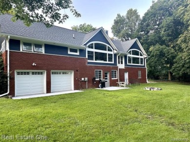 Presenting a beautifully remodeled Craftsman-style home that on Orchard Lake Country Club in Michigan - for sale on GolfHomes.com, golf home, golf lot