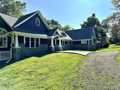 Presenting a beautifully remodeled Craftsman-style home that on Orchard Lake Country Club in Michigan - for sale on GolfHomes.com, golf home, golf lot