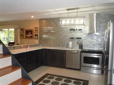 A rarity and a real beauty. Chic best describes this townhome on Holly Lake Ranch Golf Club in Texas - for sale on GolfHomes.com, golf home, golf lot