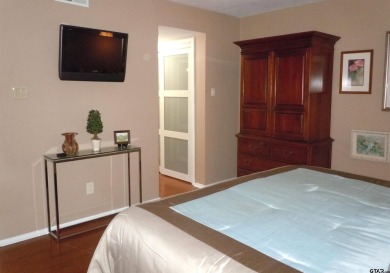 A rarity and a real beauty. Chic best describes this townhome on Holly Lake Ranch Golf Club in Texas - for sale on GolfHomes.com, golf home, golf lot