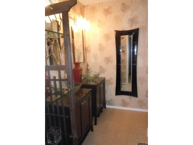 A rarity and a real beauty. Chic best describes this townhome on Holly Lake Ranch Golf Club in Texas - for sale on GolfHomes.com, golf home, golf lot