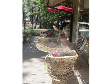 A rarity and a real beauty. Chic best describes this townhome on Holly Lake Ranch Golf Club in Texas - for sale on GolfHomes.com, golf home, golf lot