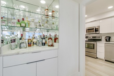 Enjoy breathtaking views from this 2 Bedroom 2 Bath corner unit on The President Country Club in Florida - for sale on GolfHomes.com, golf home, golf lot