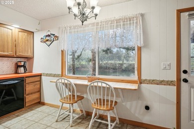 Experience rare riverfront living in a secluded Woodland on Lewis River Golf Course, Inc. in Washington - for sale on GolfHomes.com, golf home, golf lot