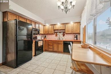 Experience rare riverfront living in a secluded Woodland on Lewis River Golf Course, Inc. in Washington - for sale on GolfHomes.com, golf home, golf lot