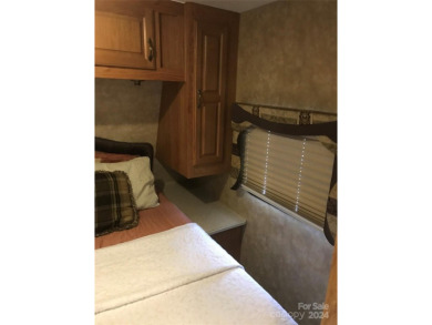 This 2008 31' Jayco RV w/ a custom-built covered structure on The Tillery Tradition Country Club in North Carolina - for sale on GolfHomes.com, golf home, golf lot