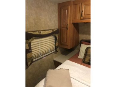 This 2008 31' Jayco RV w/ a custom-built covered structure on The Tillery Tradition Country Club in North Carolina - for sale on GolfHomes.com, golf home, golf lot