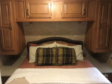 This 2008 31' Jayco RV w/ a custom-built covered structure on The Tillery Tradition Country Club in North Carolina - for sale on GolfHomes.com, golf home, golf lot