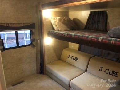 This 2008 31' Jayco RV w/ a custom-built covered structure on The Tillery Tradition Country Club in North Carolina - for sale on GolfHomes.com, golf home, golf lot