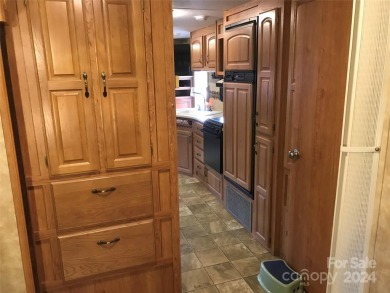 This 2008 31' Jayco RV w/ a custom-built covered structure on The Tillery Tradition Country Club in North Carolina - for sale on GolfHomes.com, golf home, golf lot