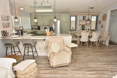 LAND OWNED-NO LAND LEASE This beautifully updated home is on Savanna Golf Club in Florida - for sale on GolfHomes.com, golf home, golf lot