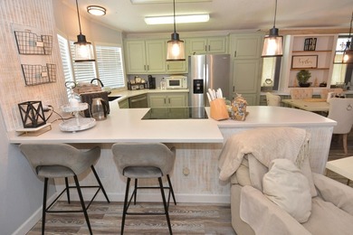 LAND OWNED-NO LAND LEASE This beautifully updated home is on Savanna Golf Club in Florida - for sale on GolfHomes.com, golf home, golf lot